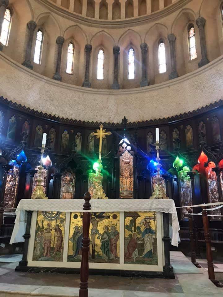 Anglican Cathedral interior — altar, mosaics, stained glass windows