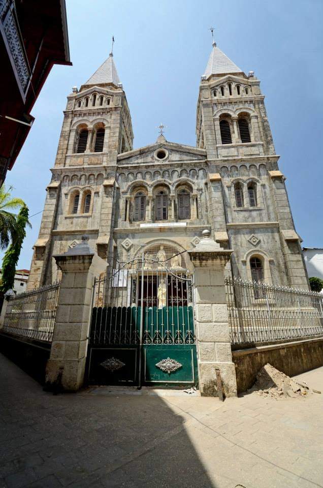 St. Joseph's Cathedral, Stone Town — twin bell towers, green ornate gates, historic architecture