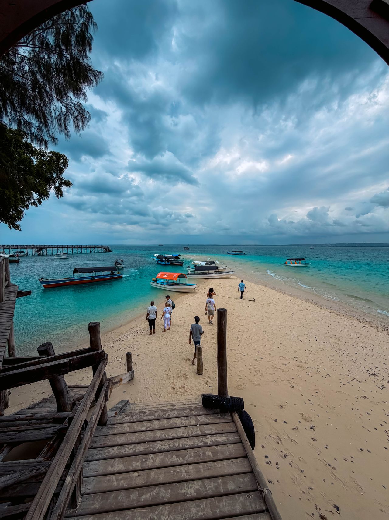 Nakupenda sandbank tour — tourists walking on white sand bar, anchored boats, turquoise waters