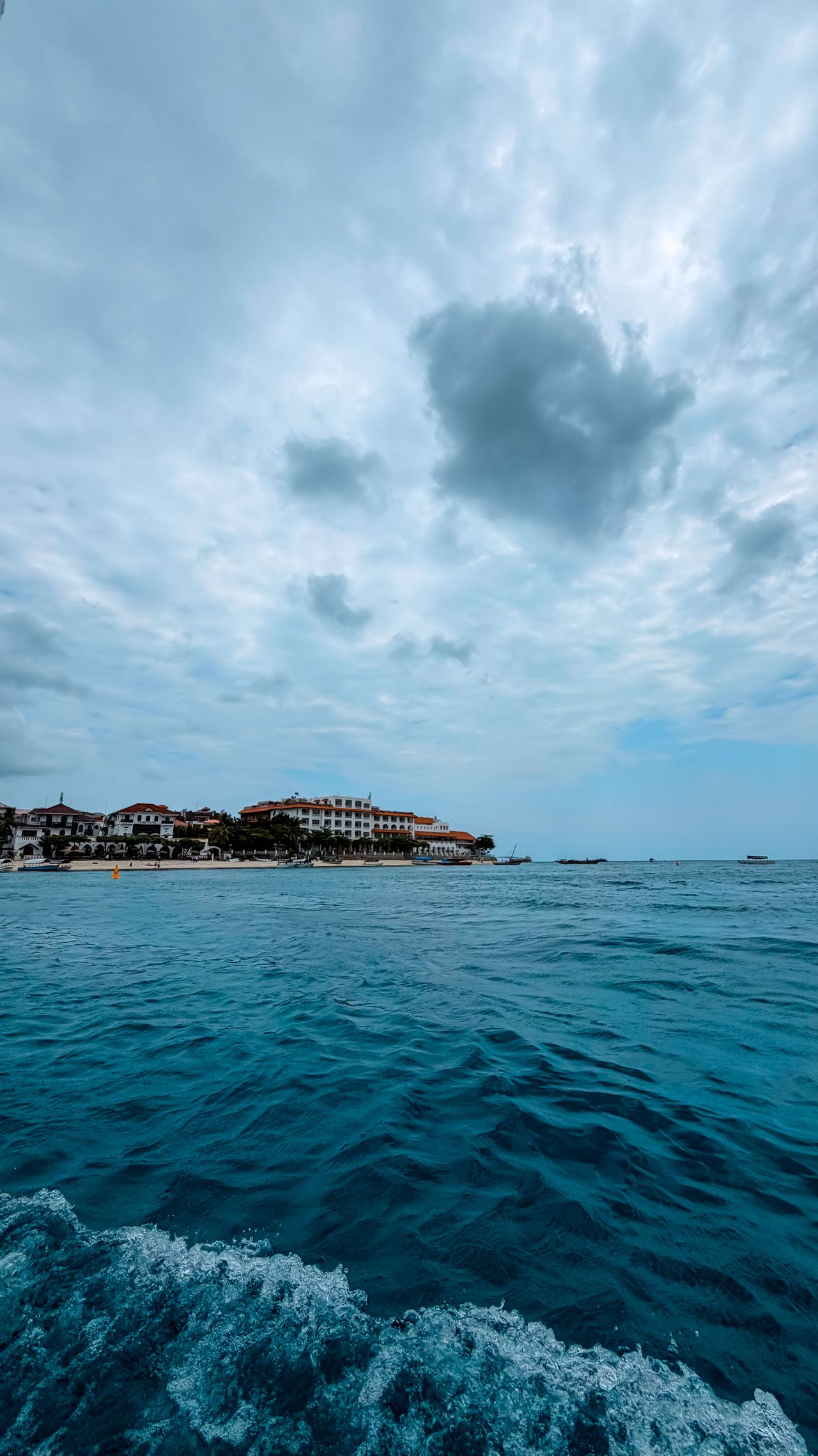 Stone Town waterfront view — historic buildings, indian ocean, coastal skyline